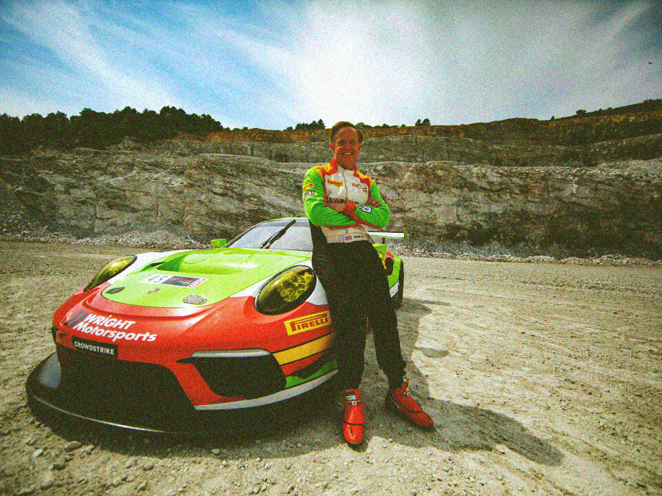 Charlie Luck IV posing with sportscar at quarry in Boscobel, VA